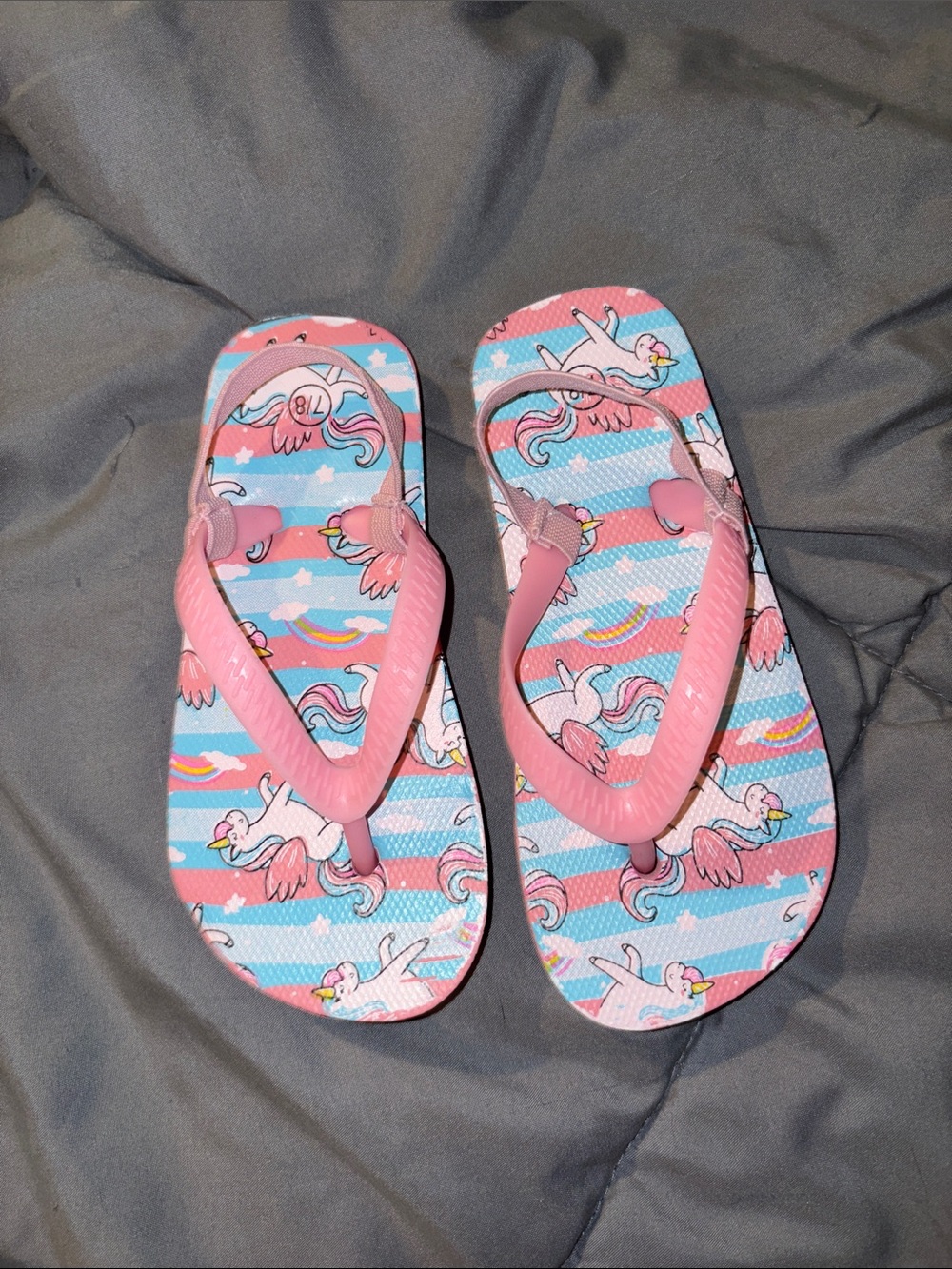 FREE with any kids purchase until gone. Pink Unicorn & Rainbow Kids Flip Flops